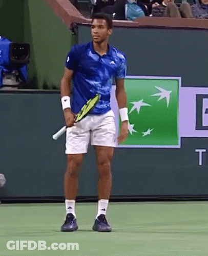 Man Holding Tennis Racquet On Court With BNP Logo GIF