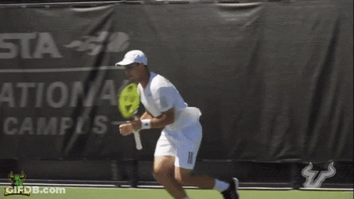 Man Holding Tennis Racquet On Court With Bullpen Logo GIF