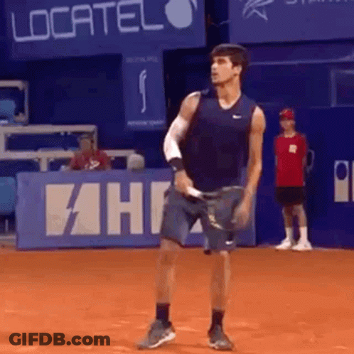 Man Holding Tennis Racquet On Court With Localiza Sign GIF