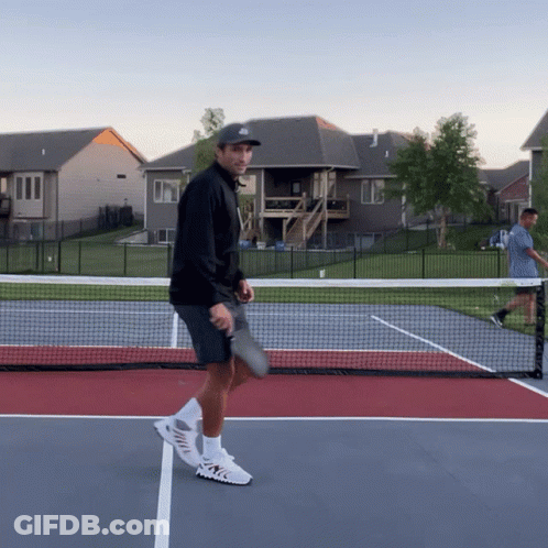 Man Holding Tennis Racquet Wearing Hat With Letter J GIF