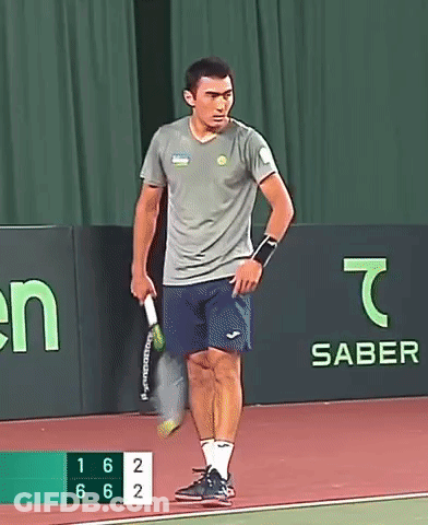 Man Holding Tennis Racquet With Saber Banner GIF