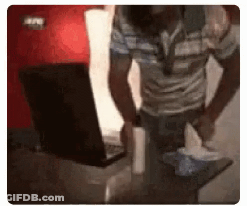 Man Holding Tissue In Front Of Laptop GIF