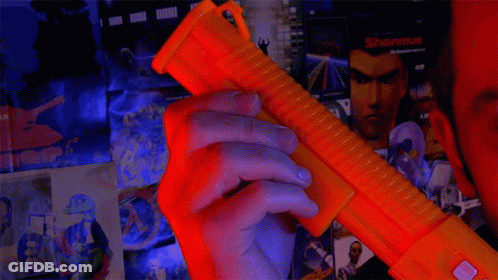 Man Holding Toy Gun That Says Wired GIF