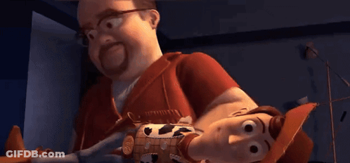 Man Holding Toy Story Woody Doll GIF