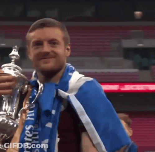 Man Holding Trophy And Wearing Blue Emirates Scarf GIF