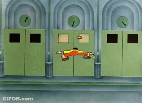 Man Holding Trophy By Elevator With Letter E GIF