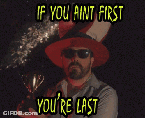 Man Holding Trophy If You Ain't First You Last GIF