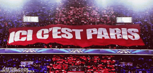 Man Holding Trophy In Front Of Canal Sign GIF