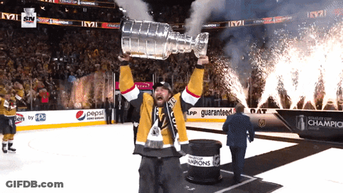 Man Holding Trophy In Front Of Pepsi Sign GIF