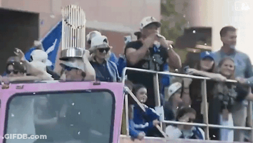 Man Holding Trophy On Pink Truck GIF