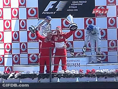 Man Holding Trophy On Podium Saying Speed GIF