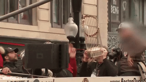 Man Holding Trophy GIF