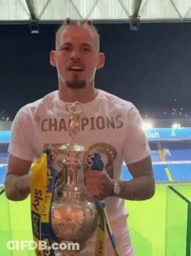 Man Holding Trophy Saying Champions GIF