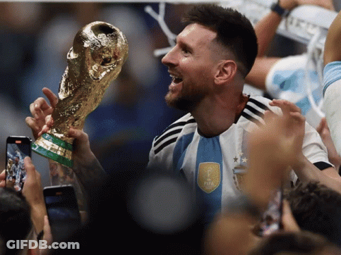 Man Holding Trophy With FIFA On Shirt GIF