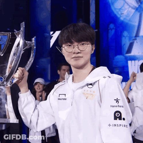 Man Holding Trophy With Hana Bank On Sleeve GIF
