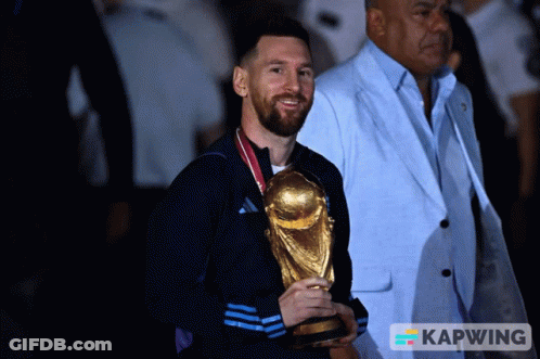 Man Holding Trophy With Kapwing Logo GIF