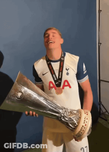 Man Holding Trophy With Medal GIF