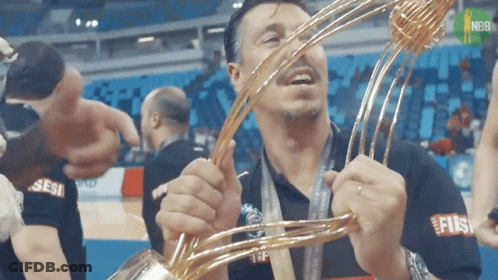 Man Holding Trophy With Sesi Shirt GIF