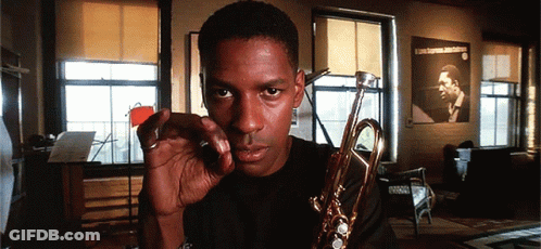 Man Holding Trumpet GIF