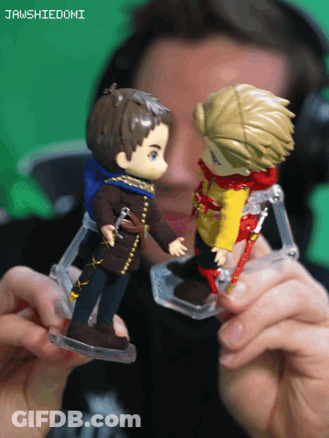 Man Holding Two Action Figures Jawshiedomi GIF