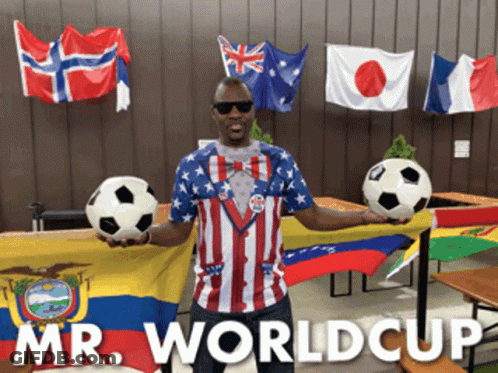 Man Holding Two Soccer Balls With Mr. World Cup Flags GIF