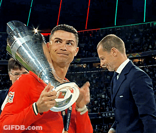 Man Holding UEFA Champions League Trophy GIF