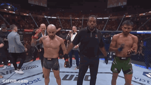 Man Holding UFC Belt In Ring GIF