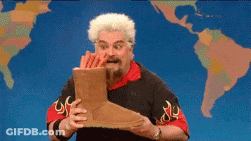 Man Holding Ugg Boots In Front Of World Map GIF
