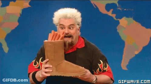 Man Holding Ugg Boots With World Map GIF
