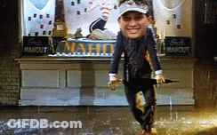 Man Holding Umbrella In Front Of Maho Sign GIF