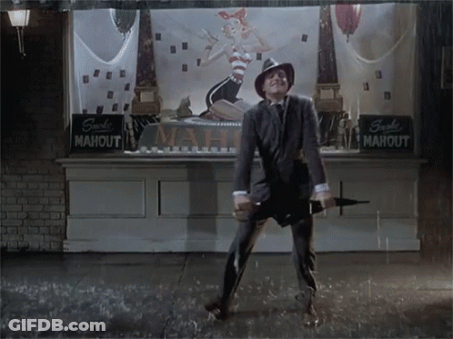 Man Holding Umbrella In Front Of Mahout Sign GIF