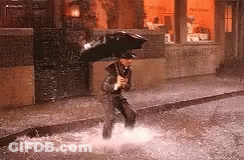 Man Holding Umbrella In Puddle GIF