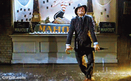 Man Holding Umbrella In Rain At Mahout Store GIF