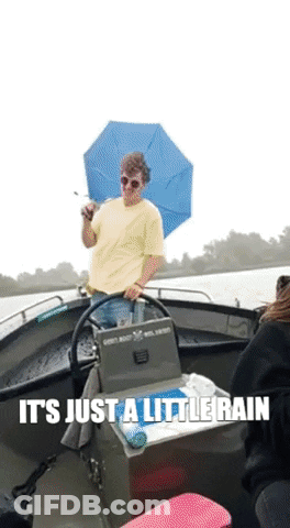 Man Holding Umbrella On Boat Saying It's Just A Little Rain GIF