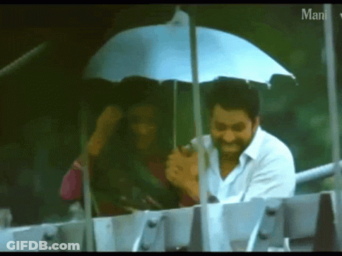 Man Holding Umbrella Over Woman Saying Man GIF