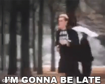 Man Holding Umbrella Saying I'm Gonna Be Late Walking Through Forest GIF