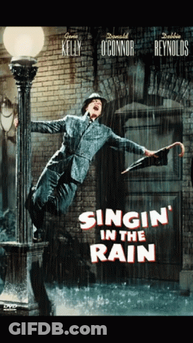 Man Holding Umbrella Singing In The Rain GIF