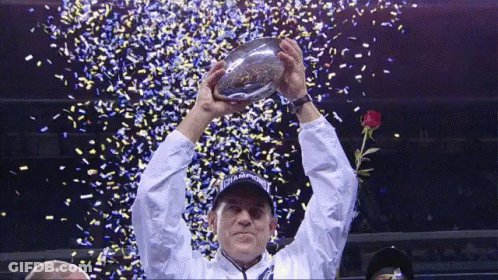 Man Holding Up Champions Trophy GIF