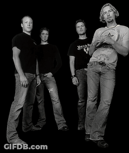 Man Holding Up Nickelback Poster GIF