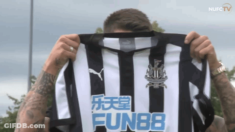 Man Holding Up Shirt Saying Fun88 GIF