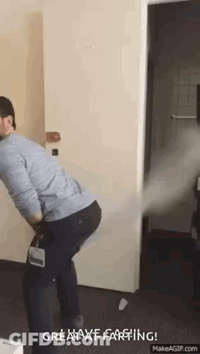 Man Holding Vacuum Cleaner In Room GIF