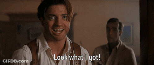 Man Holding White Cat Saying Look What I Got GIF