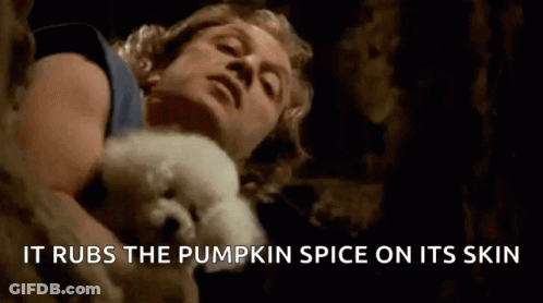 Man Holding White Dog It Rubs The Pumpkin Spice On Its Skin GIF