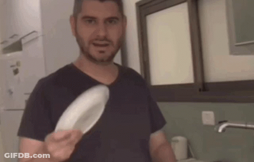 Man Holding White Plate GIF