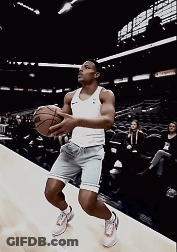 Man Holding Wilson Basketball GIF