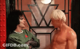 Man Holding Wine Glass Says A Toast Next To Two Women GIF