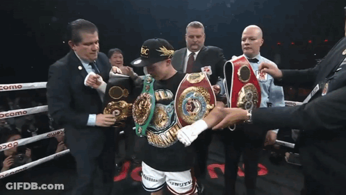 Man Holding Winning Belt In Boxing Ring GIF