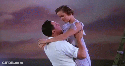 Man Holding Woman Dancing GIF
