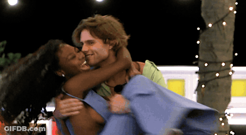 Man Holding Woman In Arms Smiling GIF
