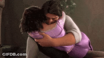 Man Holding Woman In Arms GIF